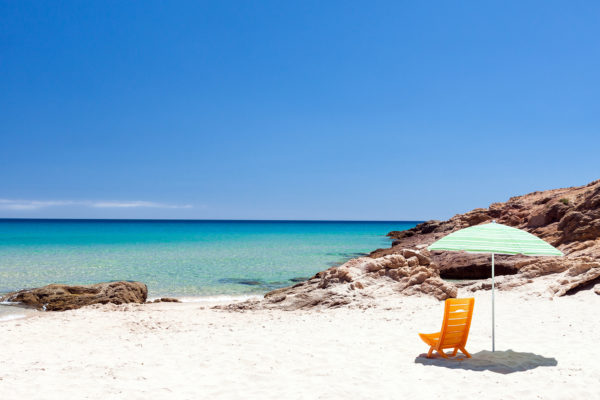lonely-lounge-chair-with-sun-umbrella-on-a-beach-i-2021-09-01-21-31-53-utc
