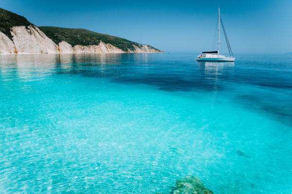 lonely-white-sailing-catamaran-boat-drift-on-calm-2021-08-27-10-00-31-utc